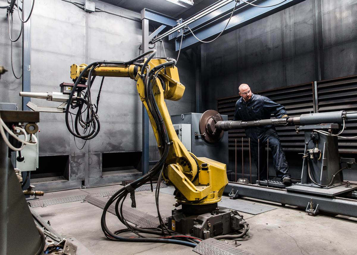 Robotic cell handling a drilling tool