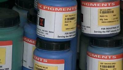 Drums of industrial pigments labelled for the FRP industry