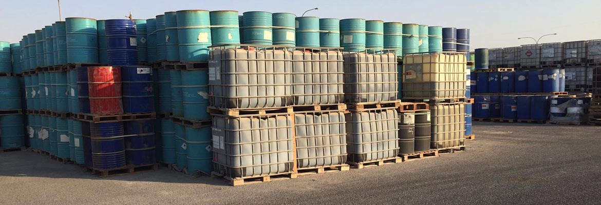 Stacked chemical drums and IBC totes in the KDC storage yard