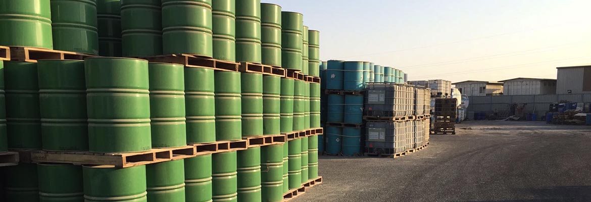 Rows of palletised green chemical drums in the KDC yard