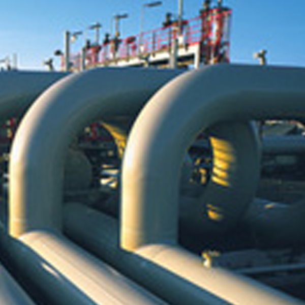 Insulated pipe runs bending through a gas plant