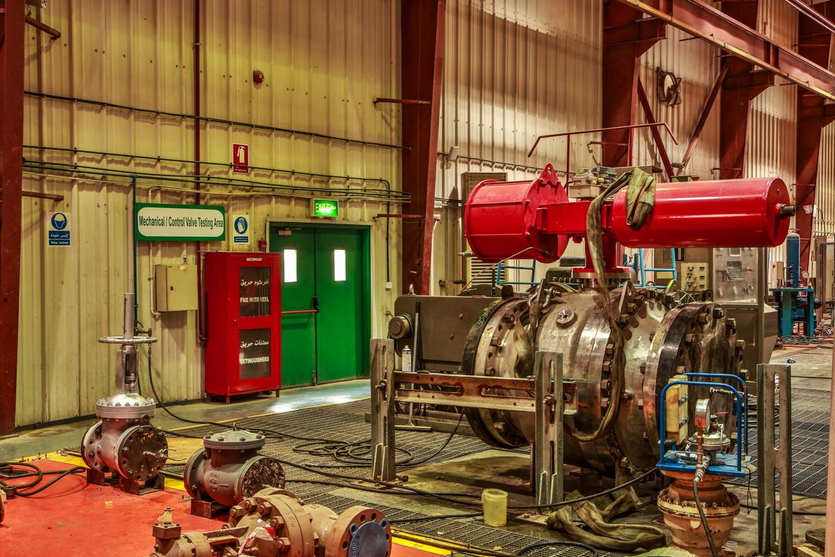 A valve with red actuators on the test bed in the mechanical and control valve testing area