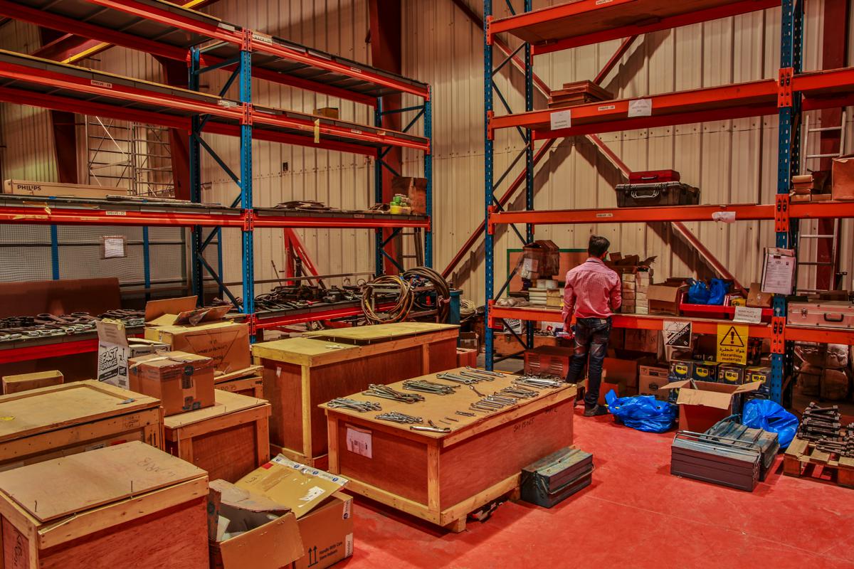 The store, with pallet racking and spanners laid out across the crate tops