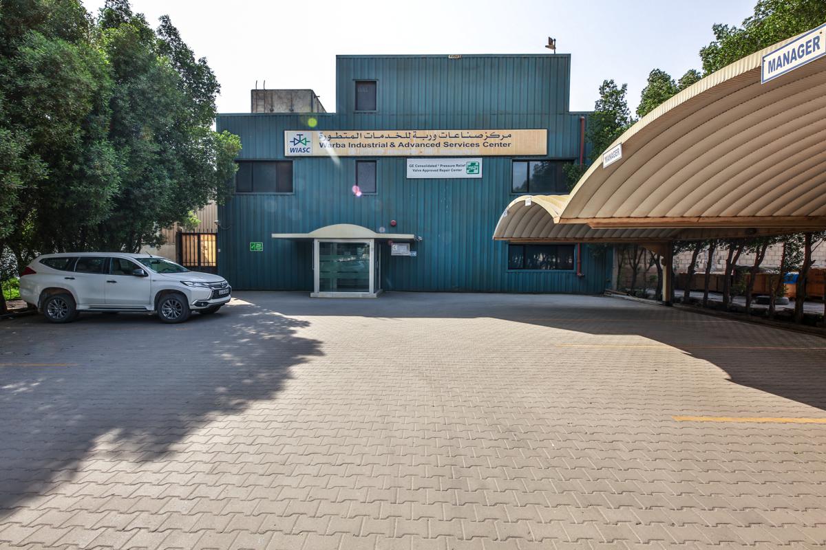 The front of the WIASC building and its covered parking