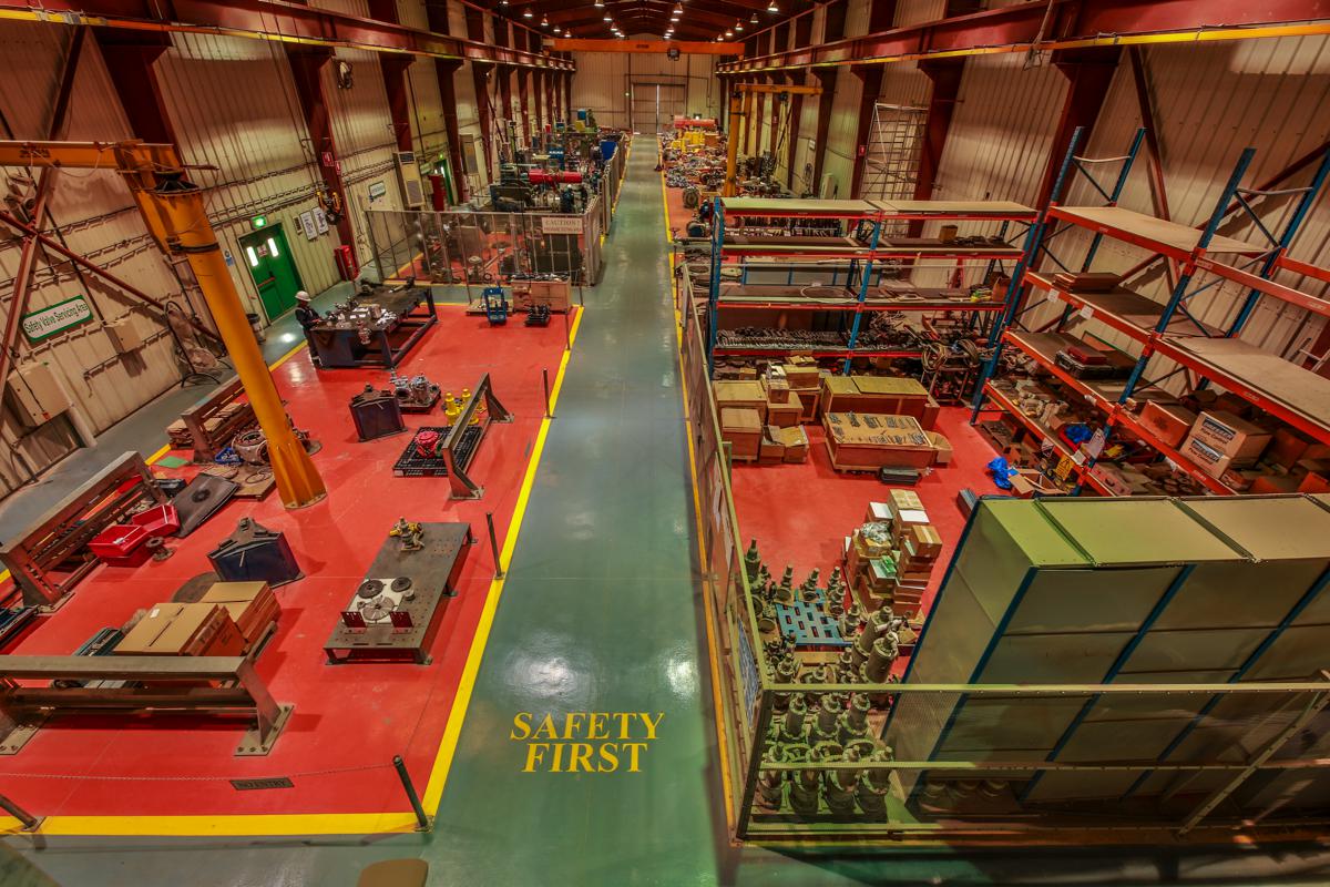 A high view across the workshop toward the far door