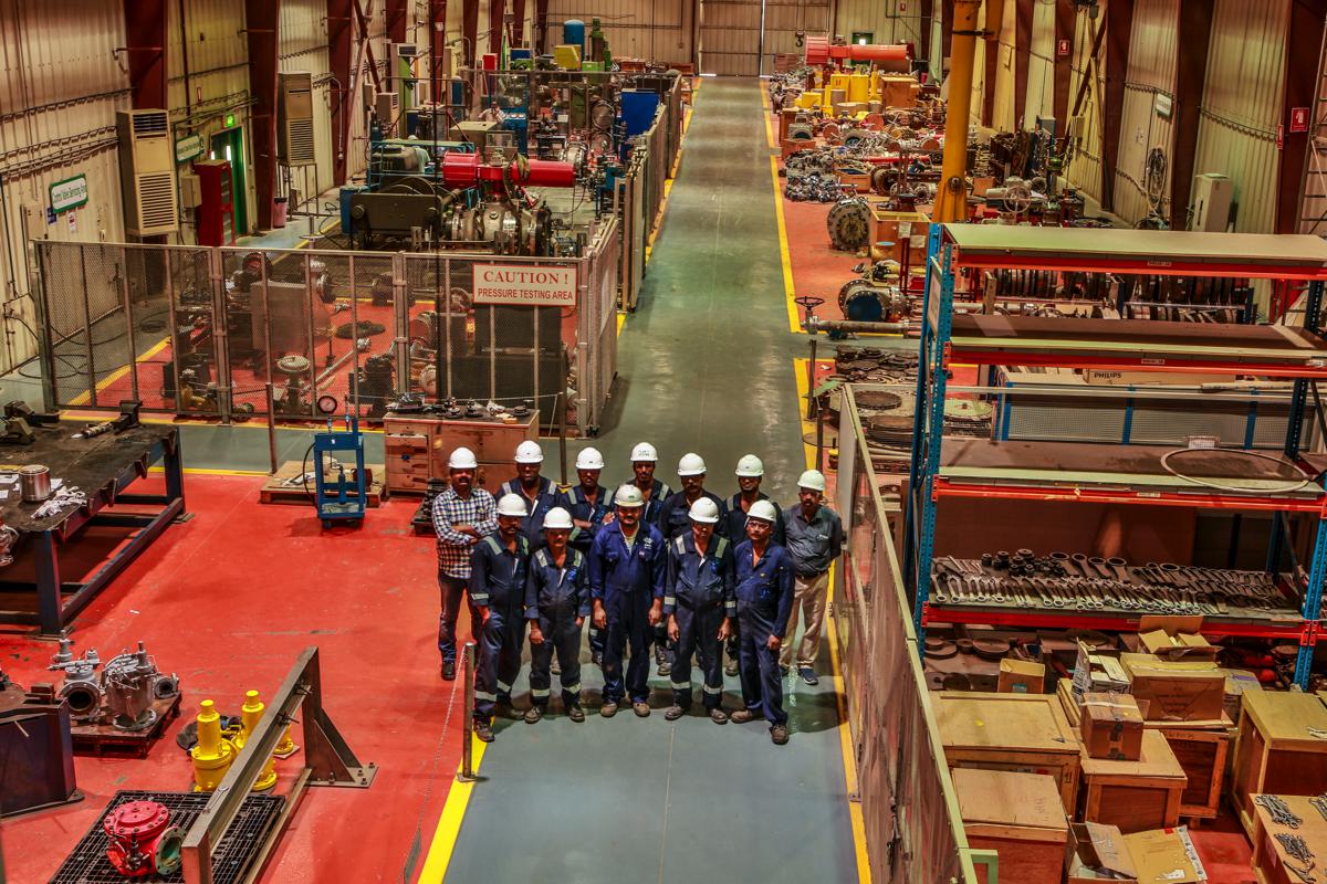 The workshop team in the pressure testing bay, photographed from above