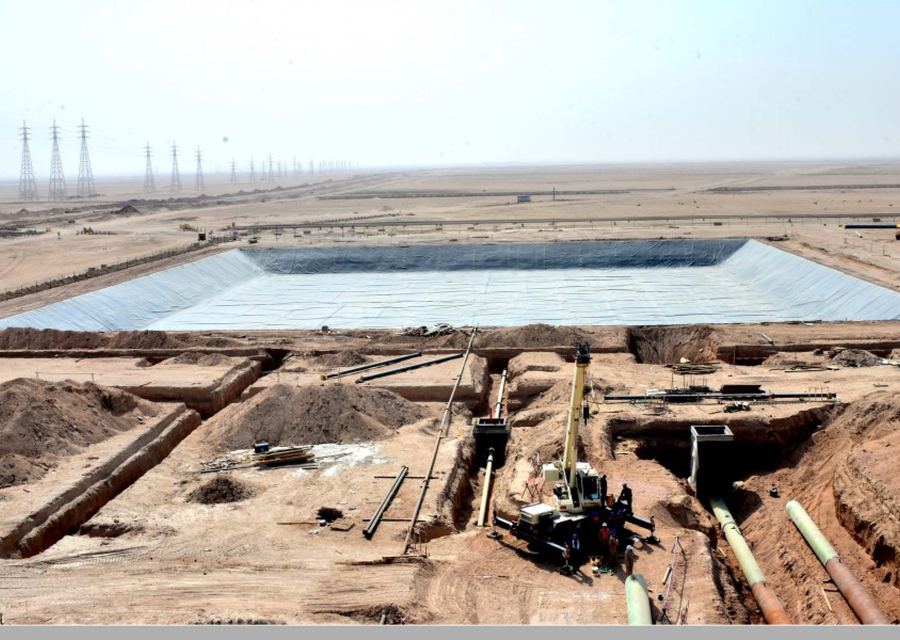 Buildings and overflow tank
